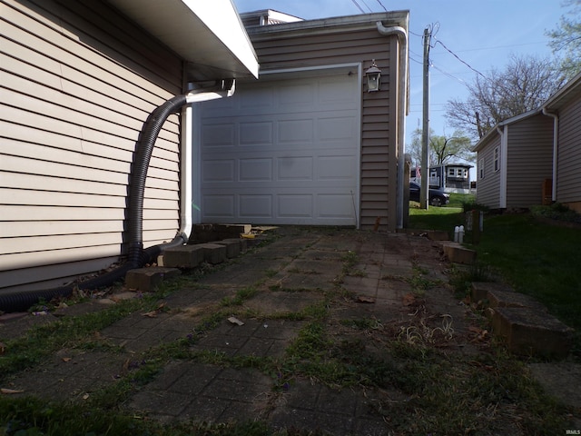 garage featuring driveway