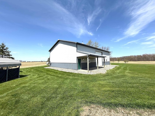 rear view of house featuring a yard