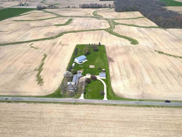 birds eye view of property featuring a rural view
