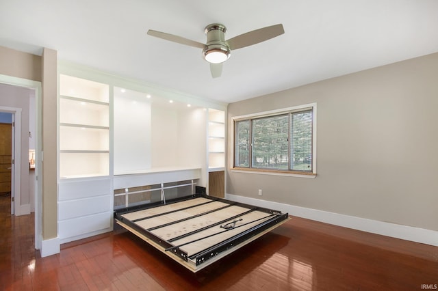 unfurnished bedroom with baseboards, ceiling fan, and hardwood / wood-style floors