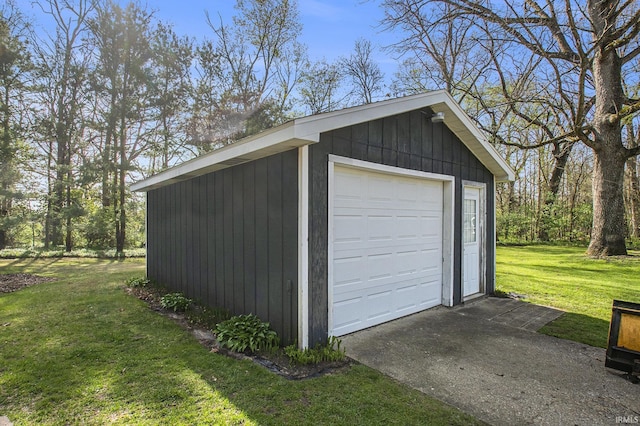 detached garage featuring driveway