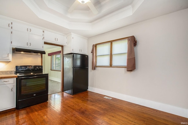 kitchen with ornamental molding, under cabinet range hood, and black appliances