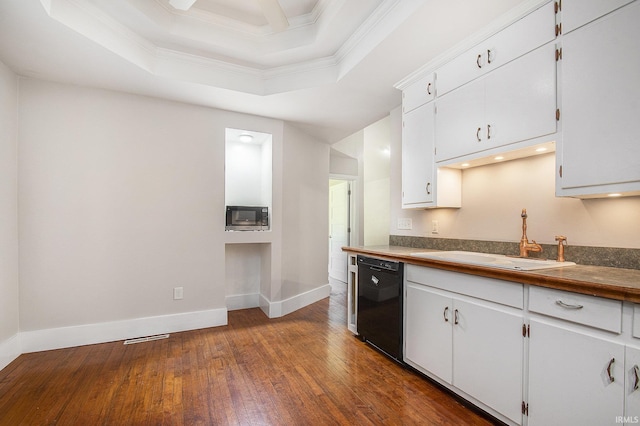 kitchen with crown molding, dark wood-style floors, built in microwave, a sink, and dishwasher