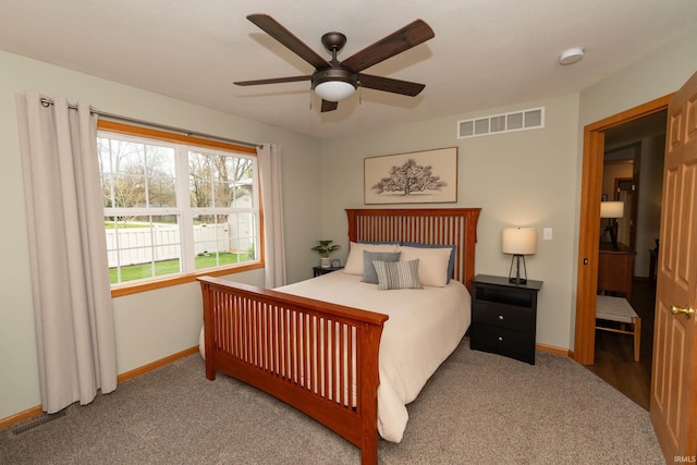 bedroom featuring baseboards, a ceiling fan, carpet floors, and visible vents