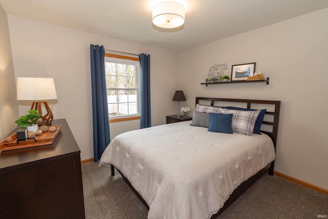 bedroom featuring baseboards and carpet flooring