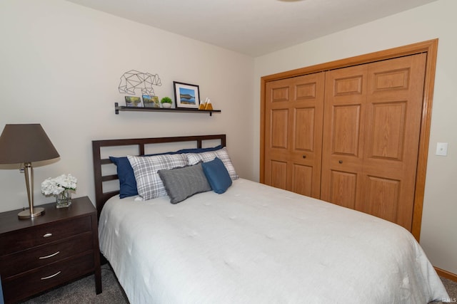 carpeted bedroom featuring a closet