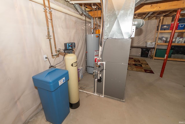 utility room with heating unit and water heater