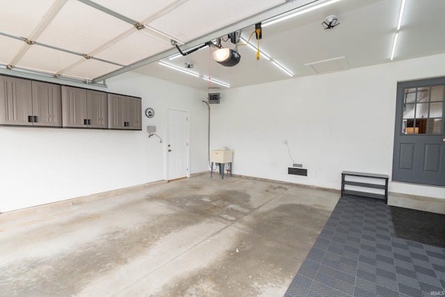 garage featuring baseboards and a garage door opener