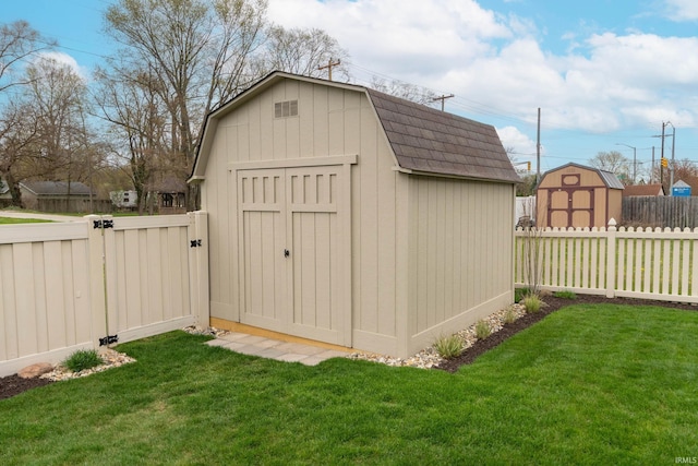 view of shed featuring a fenced backyard