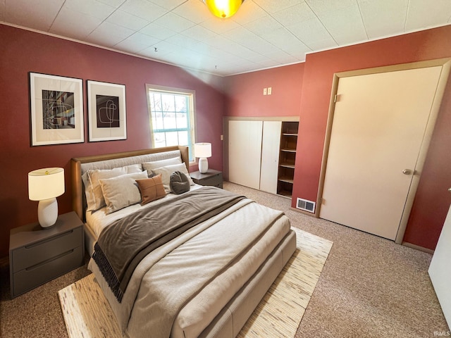 bedroom featuring visible vents and carpet flooring
