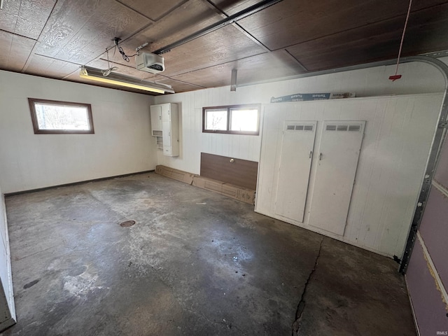 basement featuring a garage and a healthy amount of sunlight