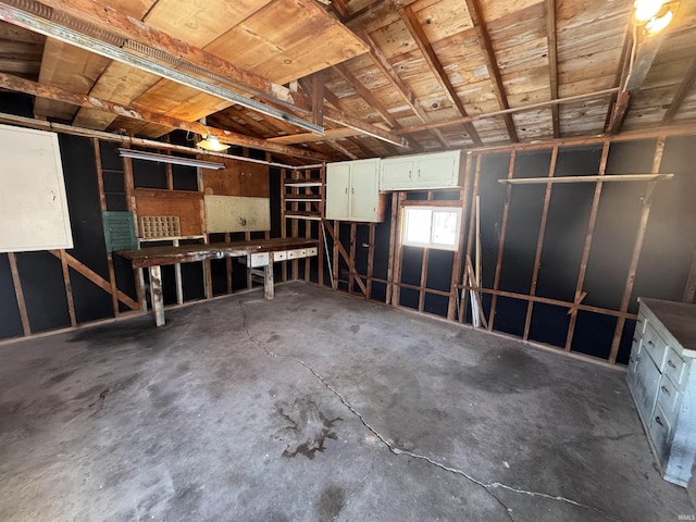 misc room featuring unfinished concrete flooring