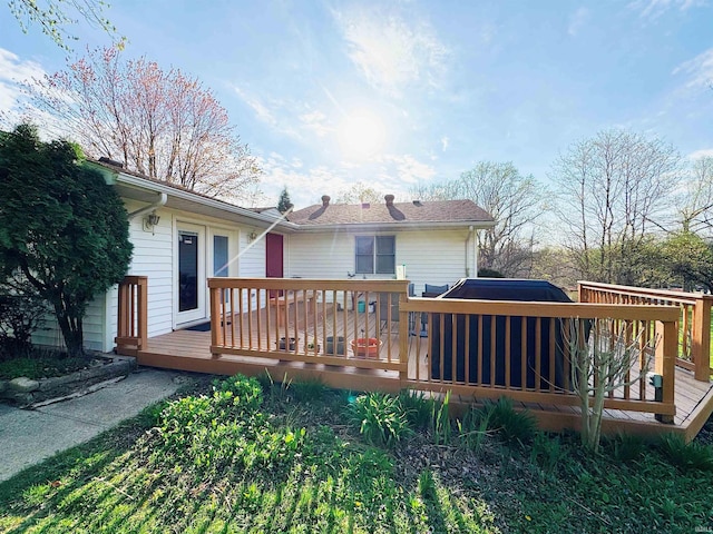 back of property featuring a wooden deck