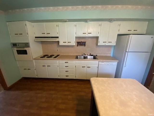 8441 E County Road 650 S, Selma, IN 47383 - kitchen featuring a sink, white appliances, white cabinetry, under cabinet range hood, and dark wood-style floors