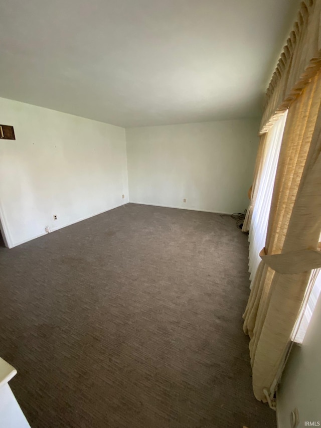 8441 E County Road 650 S, Selma, IN 47383 - spare room featuring carpet