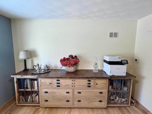2306 Carmel Dr, West Lafayette, IN 47906 - bar featuring light wood-style floors, baseboards, and visible vents