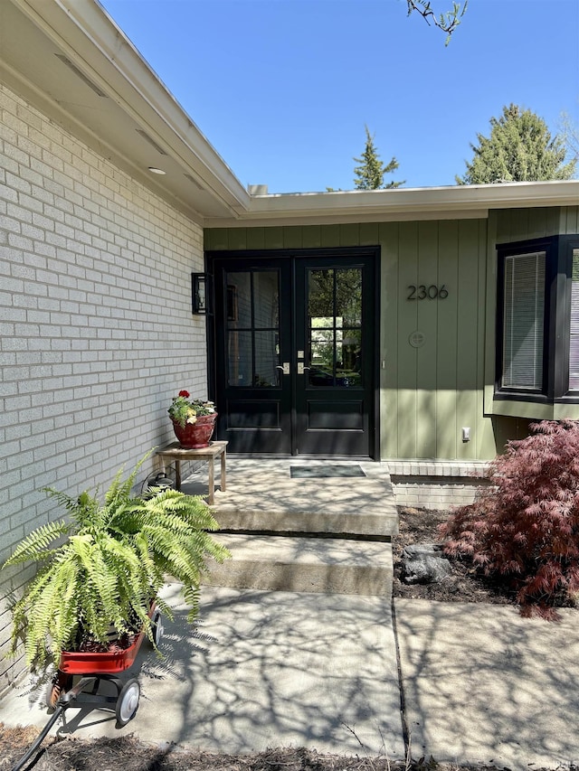 2306 Carmel Dr, West Lafayette, IN 47906 - view of exterior entry featuring brick siding and french doors