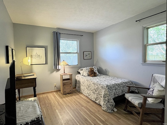2306 Carmel Dr, West Lafayette, IN 47906 - bedroom featuring light wood-style floors and baseboards