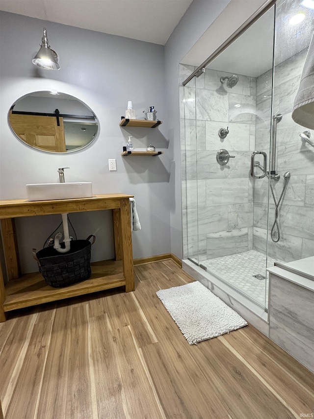 2306 Carmel Dr, West Lafayette, IN 47906 - full bath with a sink, baseboards, a shower stall, and wood finished floors