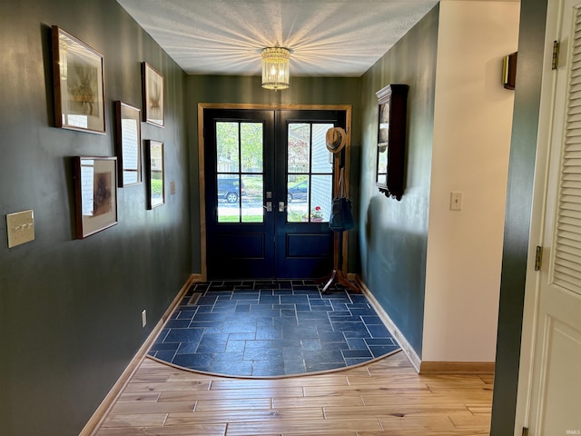 2306 Carmel Dr, West Lafayette, IN 47906 - doorway to outside featuring baseboards and french doors