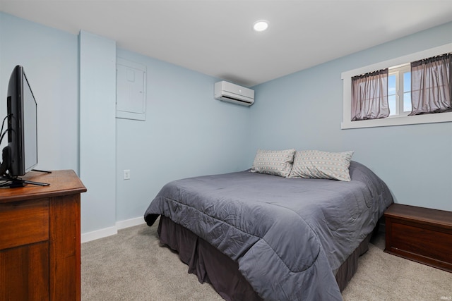 bedroom with light colored carpet, a wall mounted air conditioner, baseboards, and recessed lighting