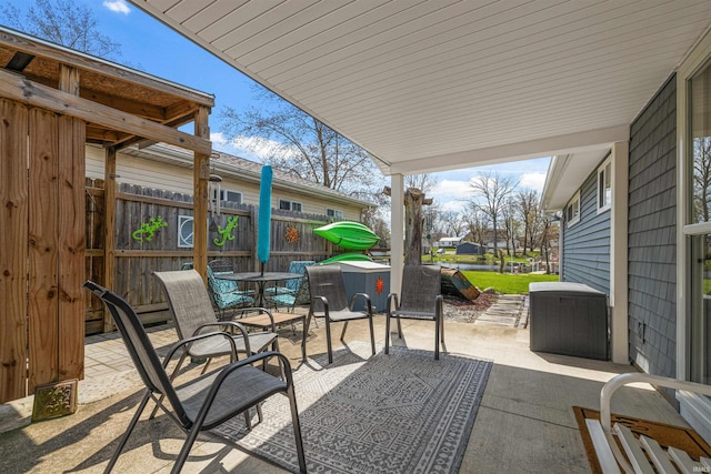 view of patio / terrace featuring fence