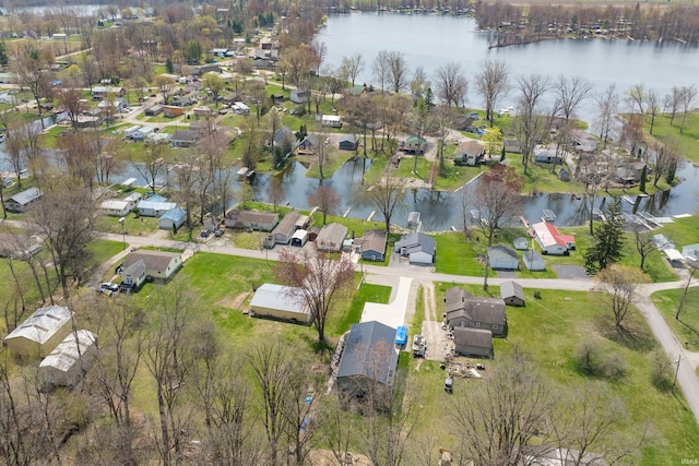 birds eye view of property with a water view and a residential view