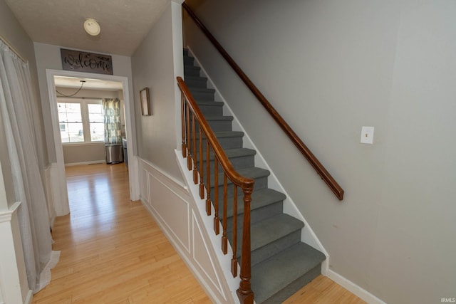 staircase featuring wood finished floors
