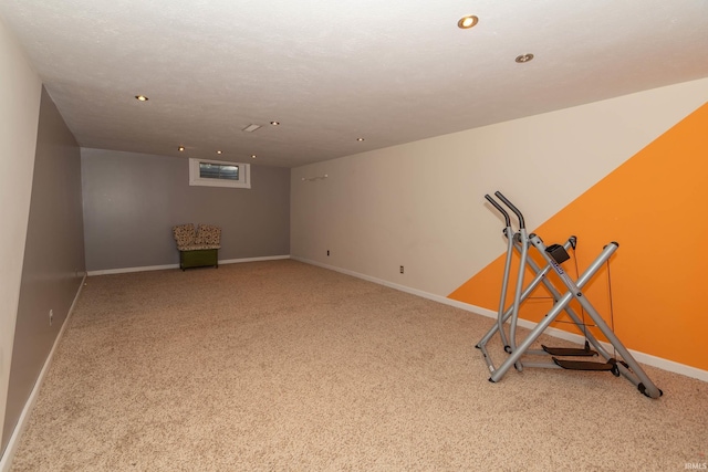 workout area featuring baseboards, recessed lighting, and carpet