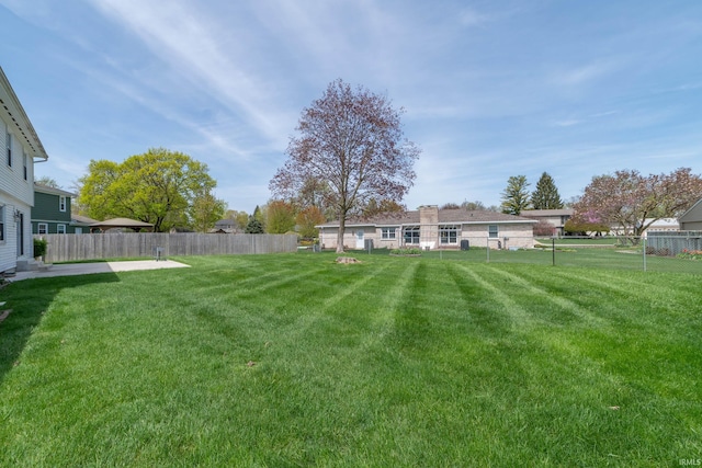 view of yard featuring a fenced backyard