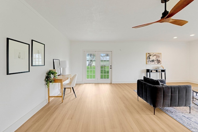 living area with a ceiling fan, baseboards, recessed lighting, and light wood-type flooring