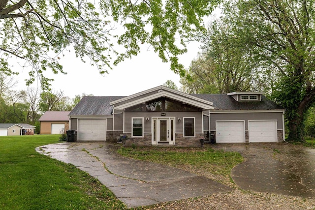 2200 33rd St, Bedford, IN 47421 - craftsman inspired home with a garage, driveway, a front lawn, and stone siding