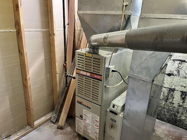 utility room with heating unit
