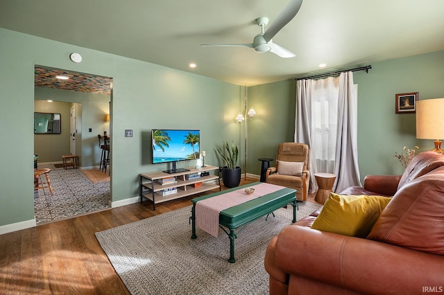 living room featuring baseboards, recessed lighting, ceiling fan, and wood finished floors
