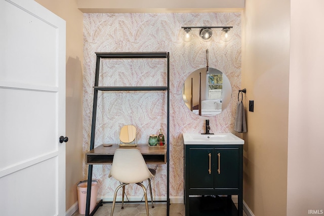 office area featuring baseboards and a sink