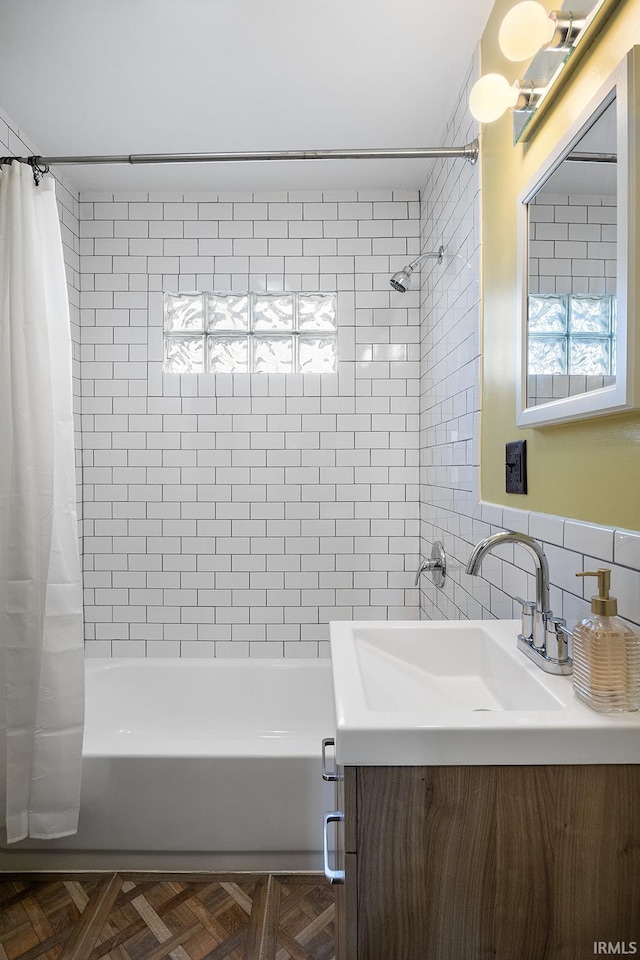 bathroom featuring decorative backsplash, tile walls, shower / bathtub combination with curtain, and vanity