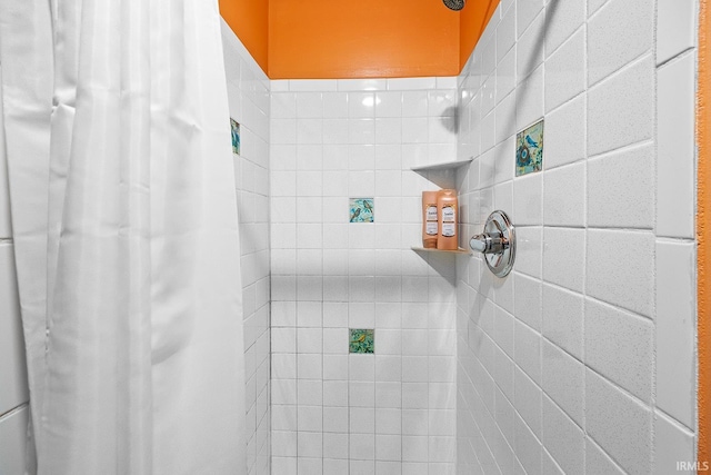 bathroom with a tile shower