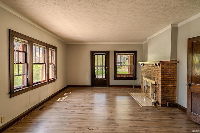 unfurnished living room with wood finished floors and a wealth of natural light