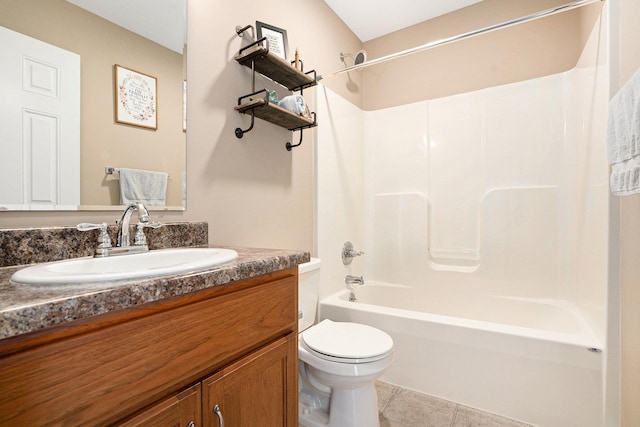full bathroom with vanity, tile patterned floors, toilet, and shower / washtub combination