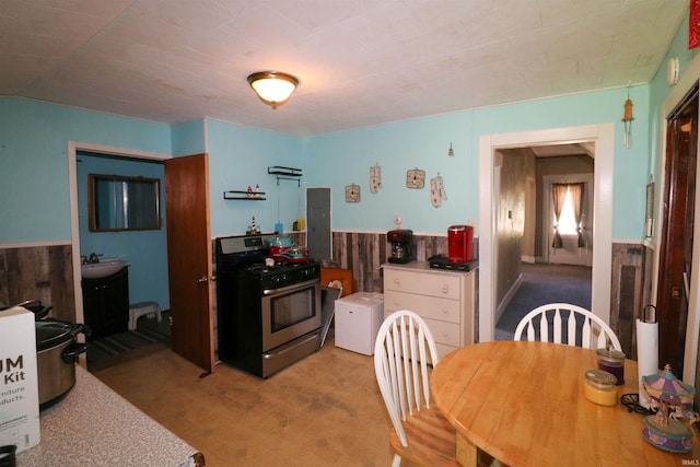 161 Orange Ave, Dunkirk, IN 47336 - dining room with light floors, electric panel, and wainscoting