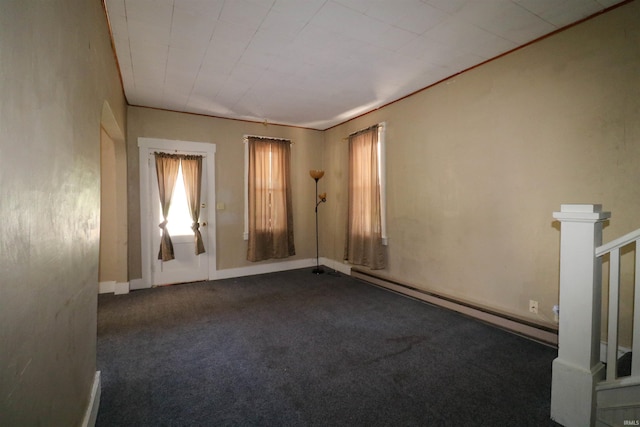161 Orange Ave, Dunkirk, IN 47336 - empty room with a baseboard radiator, carpet flooring, and a wealth of natural light