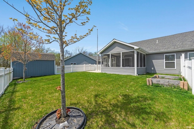 view of yard with an outdoor structure, a garden, a fenced backyard, a sunroom, and a storage shed