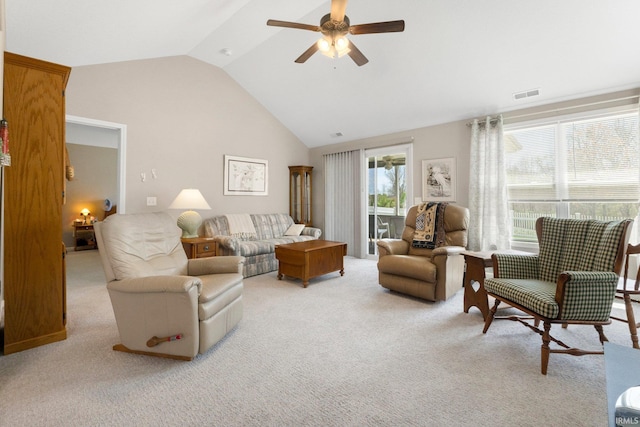 living area with carpet floors, ceiling fan, visible vents, and high vaulted ceiling