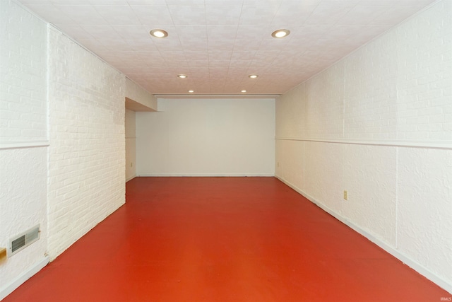 finished basement featuring recessed lighting and visible vents