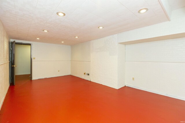 finished basement featuring recessed lighting and baseboards