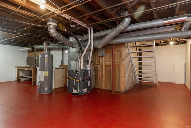 unfinished below grade area with heating unit, concrete block wall, stairway, and gas water heater