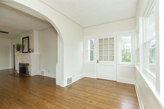 interior space with arched walkways and visible vents