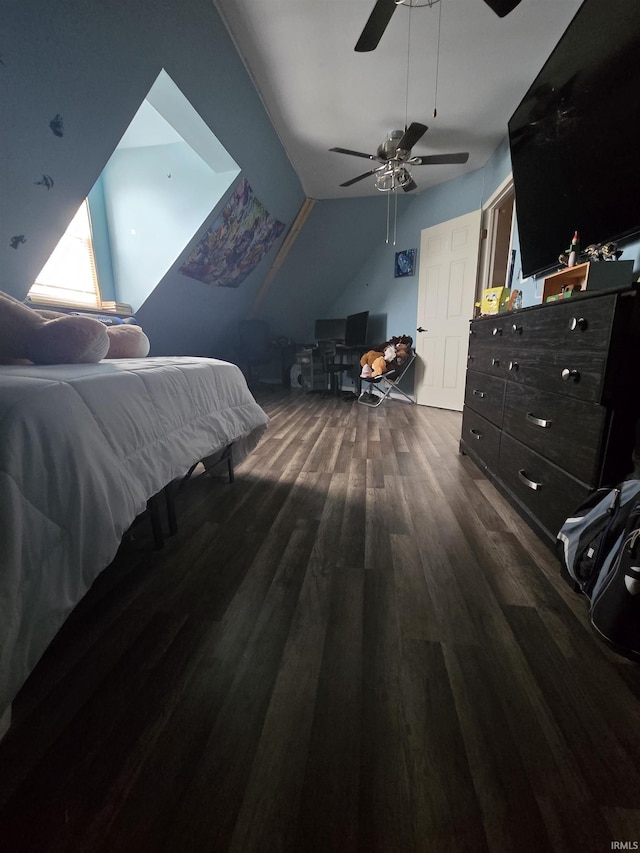 bedroom featuring lofted ceiling, wood finished floors, and ceiling fan