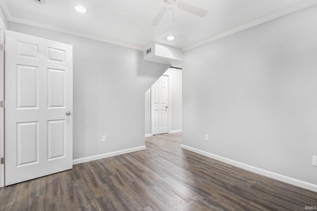 interior space featuring baseboards, crown molding, and wood finished floors