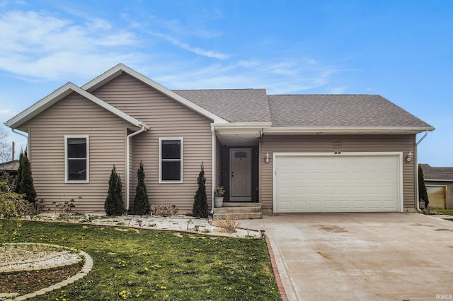 single story home featuring an attached garage, a shingled roof, a front lawn, and concrete driveway